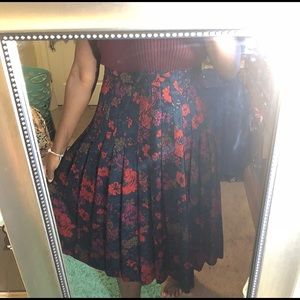 A floral printed, midi pleated skirt.